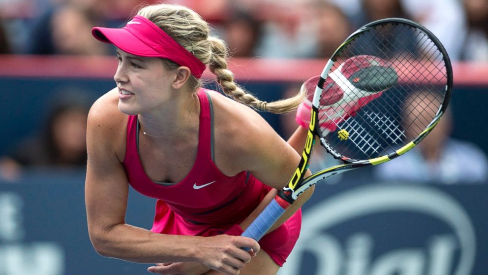 Eugenie Bouchard, of Canada, serves to Shelby Rogers, of the United States, at the Rogers Cup tennis tournament, Aug. 5, 2014, in Montreal.