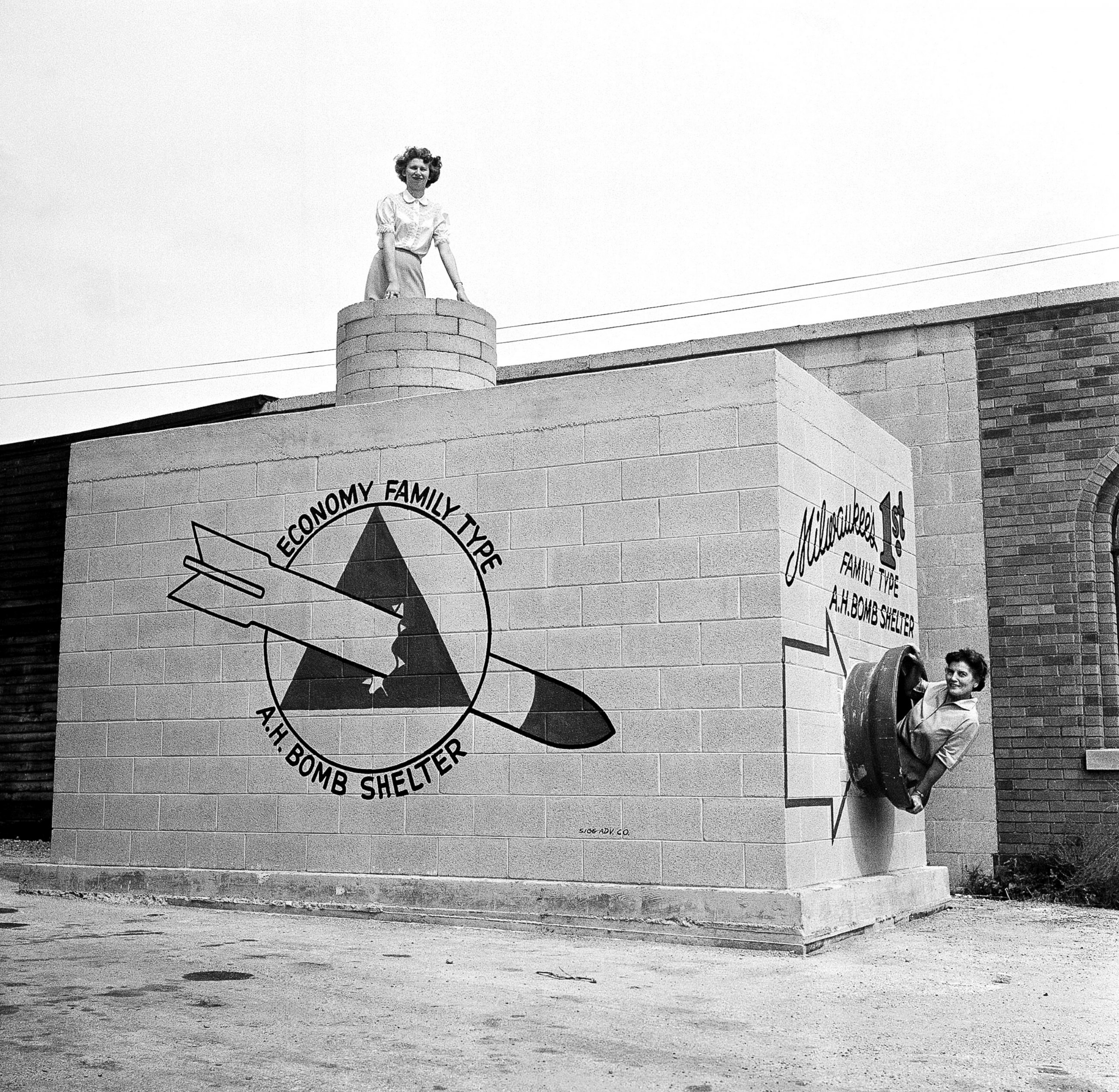 PHOTO: Women emerge from a new family-type bomb shelter on display in Milwaukee, Sept. 12, 1958.