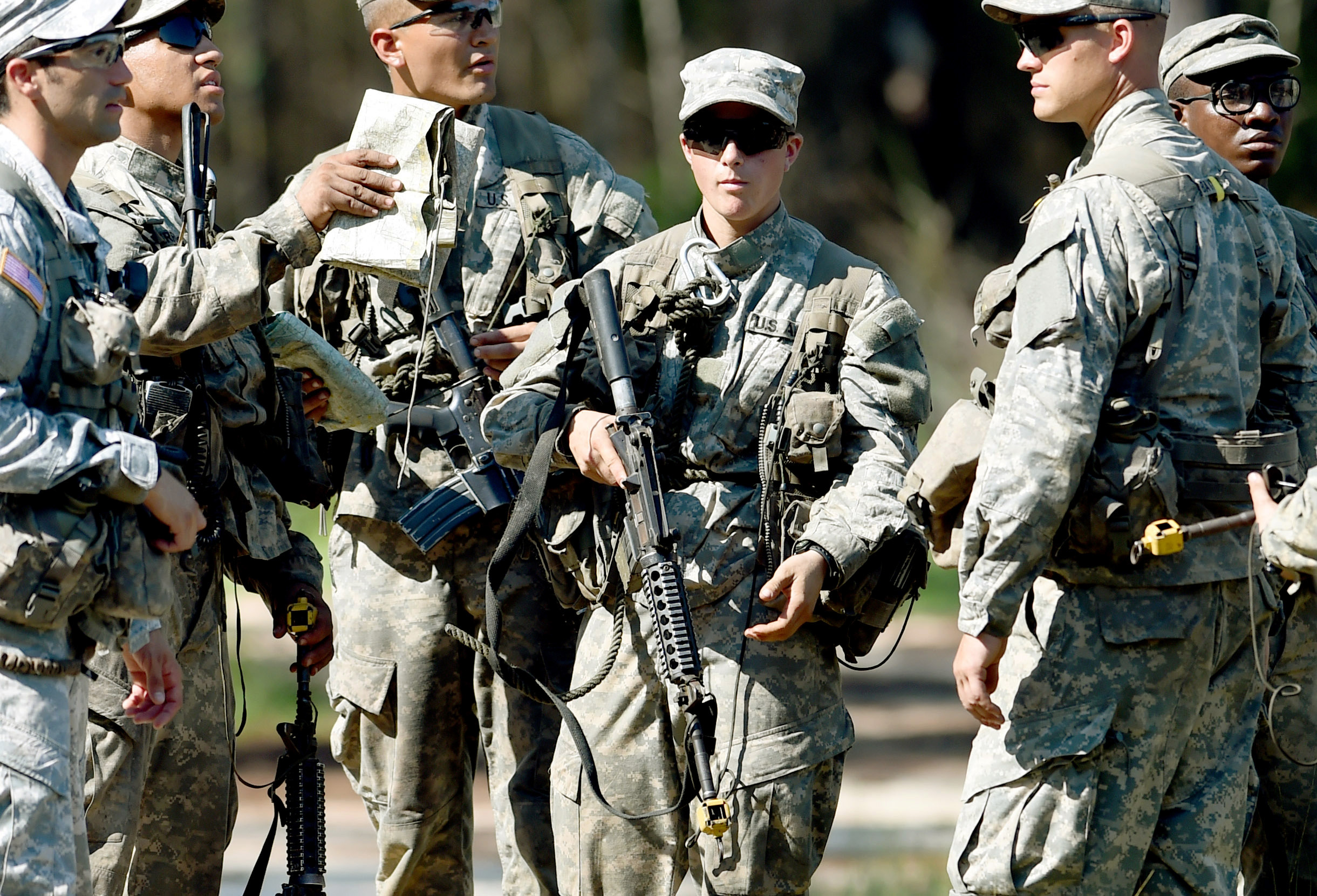 PHOTO: A female Army Ranger stands with her unit during Ranger School at Camp Rudder on Eglin Air Force Base, Fla. 