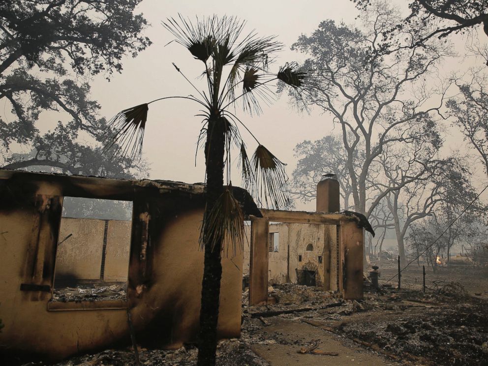 PHOTO: A frame and trees are all that is left around a home destroyed by fire, Sept. 13, 2015, in Middletown, Calif.