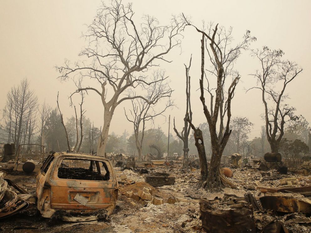 PHOTO: A burned vehicle remains among a number of homes destroyed by fire, Sept. 13, 2015, in Middletown, Calif.