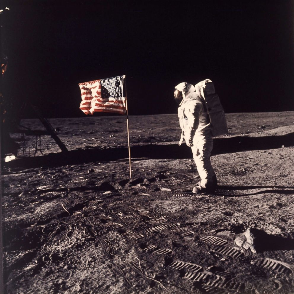 PHOTO: In this July 20, 1969, file photo, astronaut Edwin E. "Buzz" Aldrin Jr. stands next to a U.S. flag planted on the moon during the Apollo 11 mission. Aldrin and Neil Armstrong were the first men to walk on the lunar surface.  