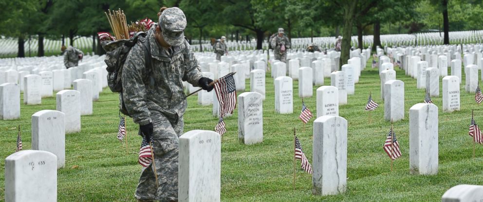 Honoring the Fallen: Soldiers Adorn Cemetery With American Flags in ...