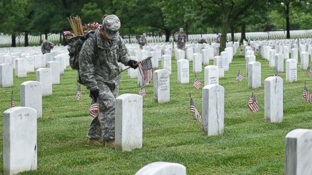 Honoring The Fallen: Soldiers Adorn Cemetery With American Flags In ...