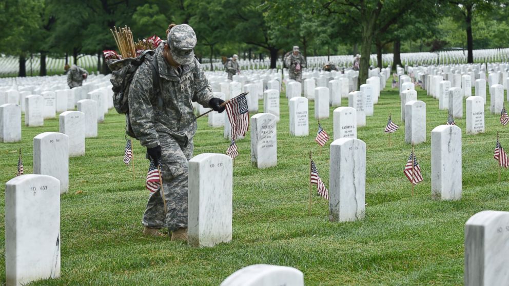 Honoring the Fallen: Soldiers Adorn Cemetery With American Flags in ...