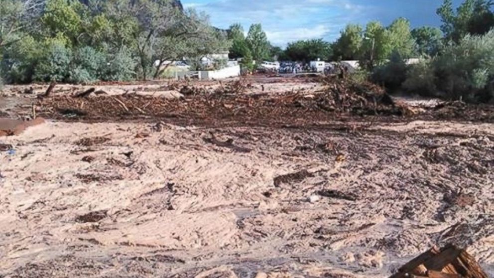 PHOTO:Debris and water cover the ground after a flash flood, Sept. 14, 2015, in Hildale, Utah