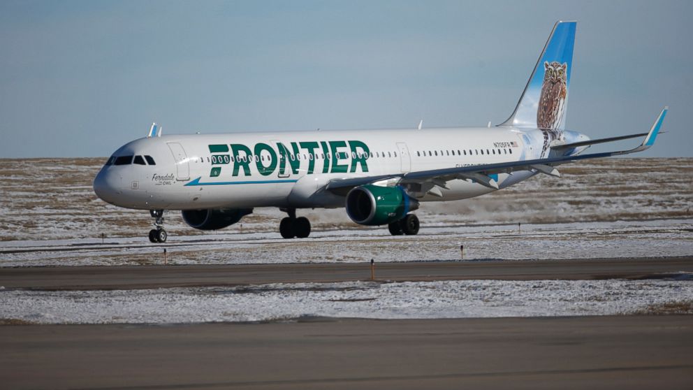 In this photograph taken Feb. 8, 2016, a Frontier Airlines plane heads to a runway at Denver International Airport.