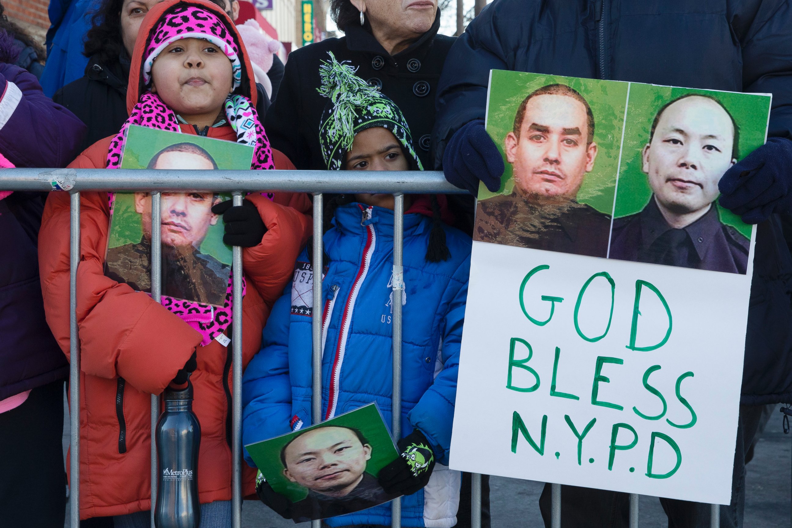 PHOTO: Mourners stand at a barricade near Christ Tabernacle Church 