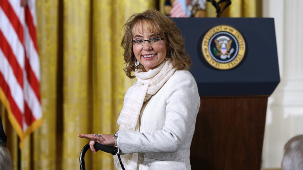 Gabby Giffords arrives in the East Room of the White House in Washington to hear President Obama speak about steps his administration is taking to reduce gun violence, Jan. 5, 2016.