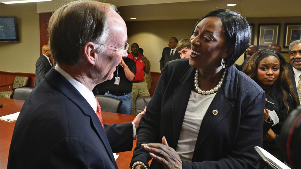 In this file photo, Gwendolyn Boyd, right, greets Alabama Gov. Robert Bentley, left, after the Alabama State University Board of Trustees offered her the presidency of the university on Dec. 20, 2013, at the ASU campus in Montgomery, Ala.