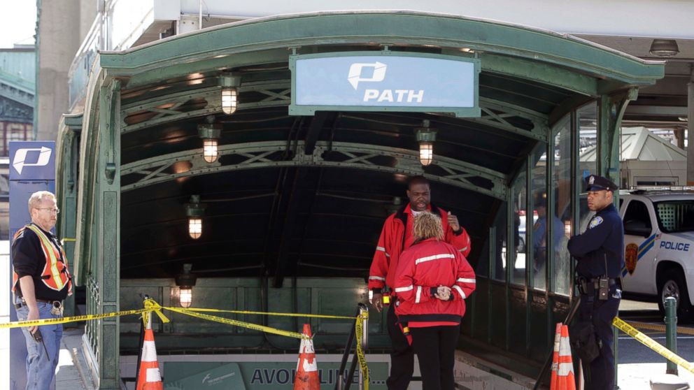 Emergency personnel gather near the entrance to the PATH station in Hoboken, May 8, 2011. 
