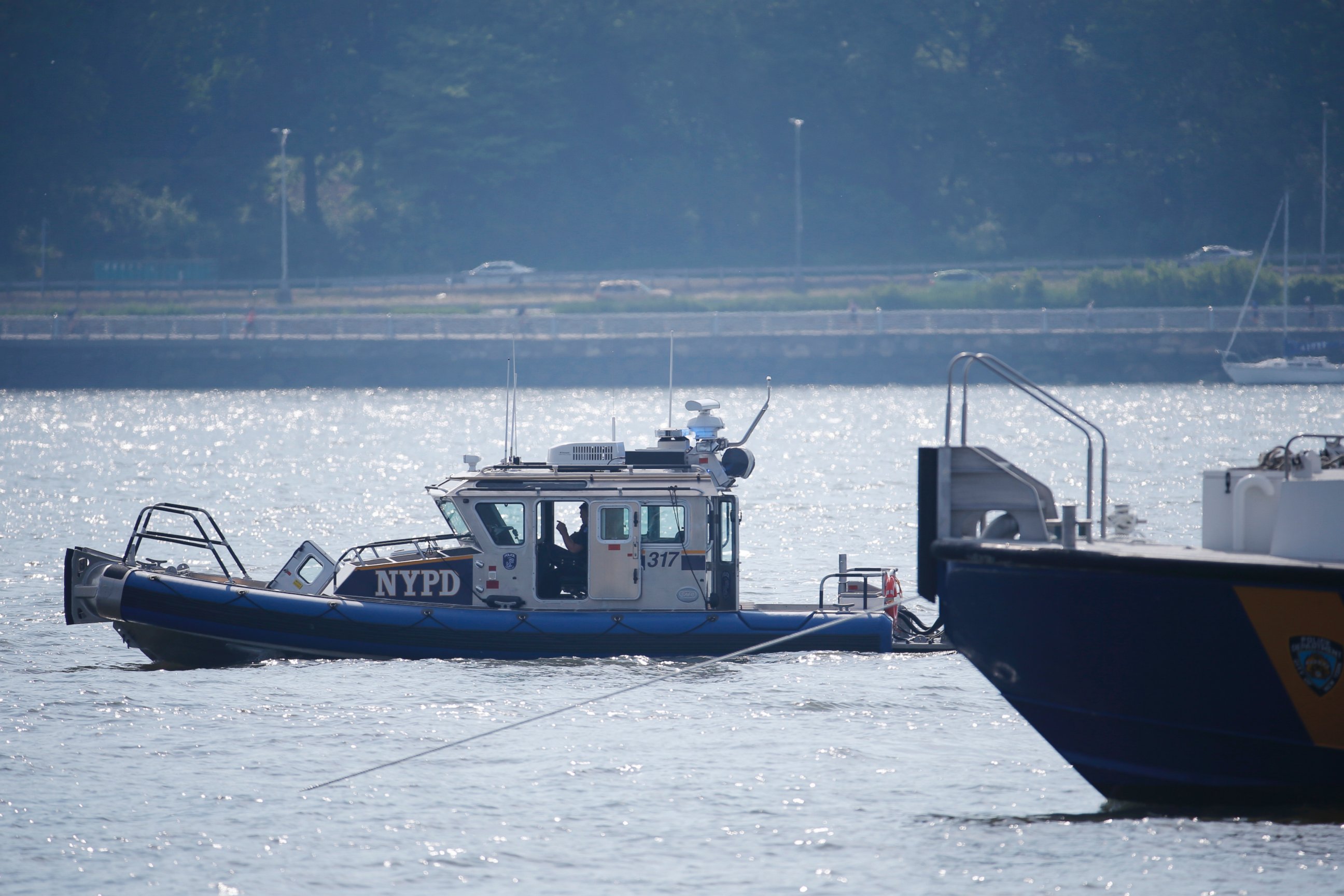 PHOTO: NYPD search and rescue boats sit on the Hudson River near the site of small plane crash, May 28, 2016, in North Bergen, N.J. 