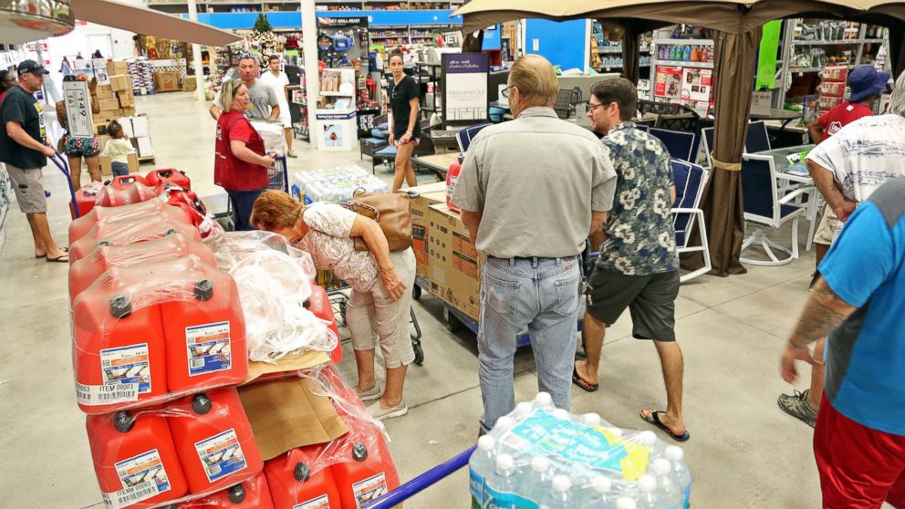 PHOTO: Shoppers look for items amid the generators, cases of water and gas cans at Lowe's in Oakland Park, Florida, Oct. 4, 2016.