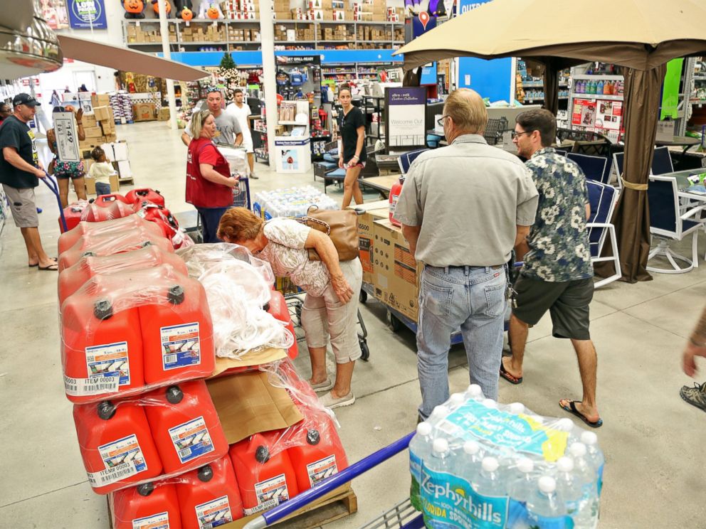 PHOTO: Shoppers look for items amid the generators, cases of water and gas cans at Lowes in Oakland Park, Florida, Oct. 4, 2016.