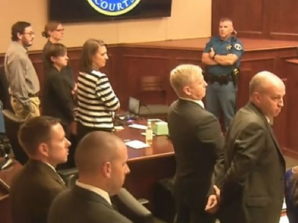 PHOTO: Defendant James Holmes, top left in tan shirt, defense attorneys and prosecuting attorneys watch as the jury exits the courtroom after delivering their sentencing verdict in the Colorado theater shooting trial in Centennial, Colo.,Aug. 7, 2015.