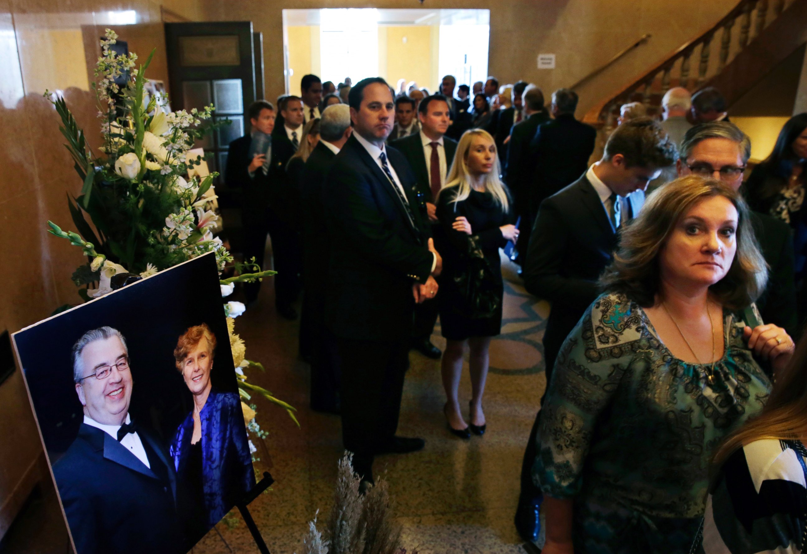 PHOTO: People file past a portrait of John and Joyce Sheridan, into a memorial service for the couple at the War Memorial, Oct. 7, 2014, in Trenton, N.J.
