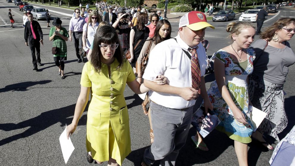 PHOTO: Kate Kelly, left, walks with supporters to the Church Office Building of the Church of Jesus Christ of Latter-day Saints, June 22, 2014, in Salt Lake City. 