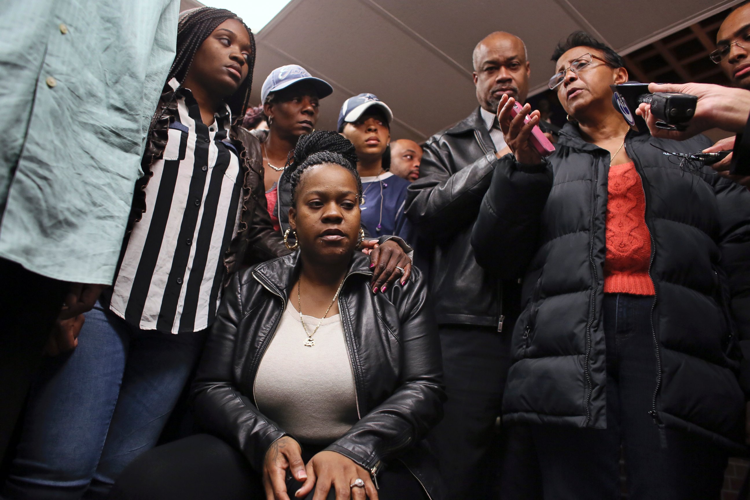 PHOTO: Family members surround Keisha Gaither, seated at center, mother of Carlesha Freeland-Gaither, during a news conference in Philadelphia on Nov. 2, 2014. 
