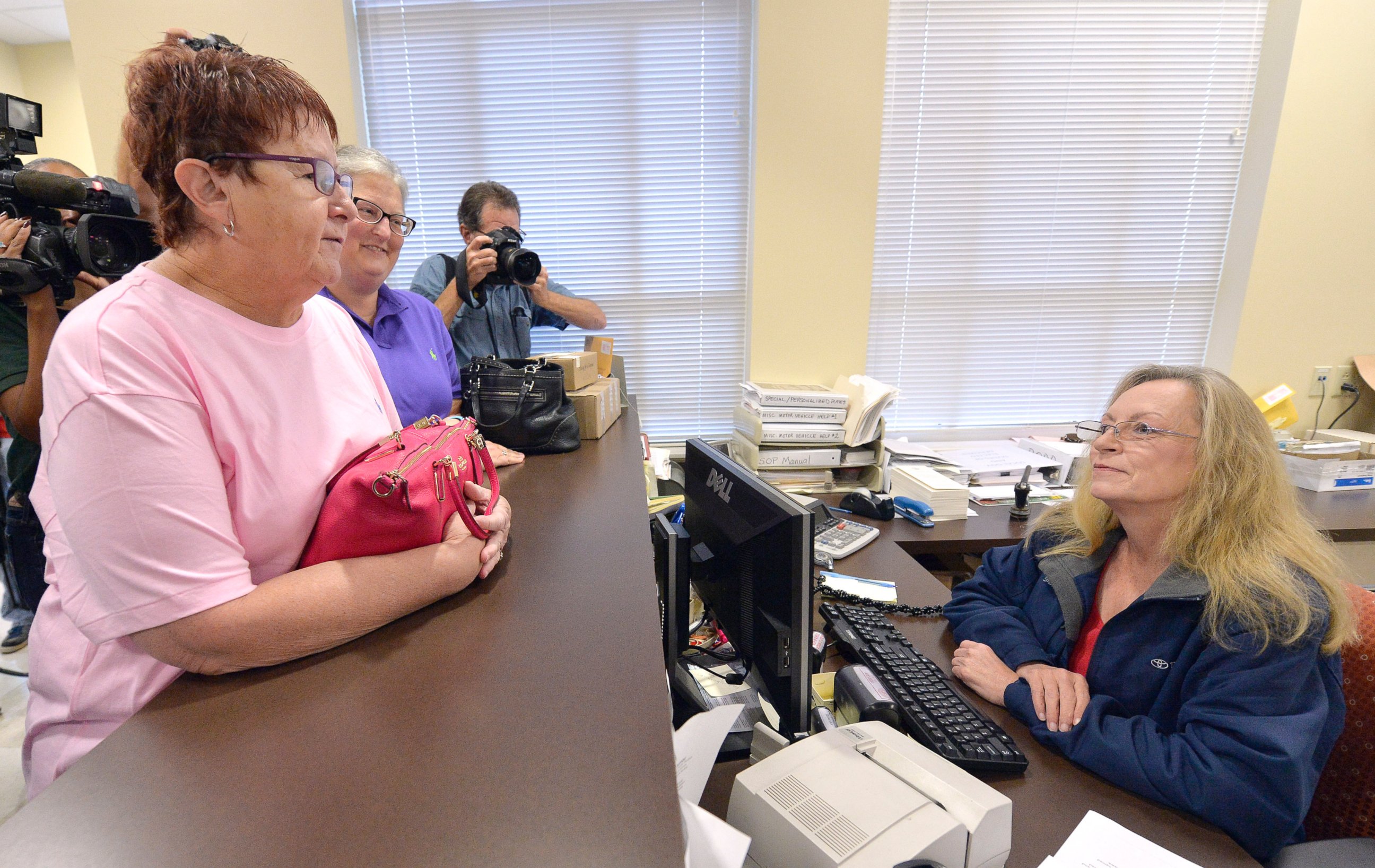 PHOTO:Karen Roberts, left, and her partner, April Miller, speak to Assistant Rowan County Clerk Kim Russell as they attempt to get a marriage license, Sept. 1, 2015, at the Rowan County Courthouse in Morehead, Ky.  