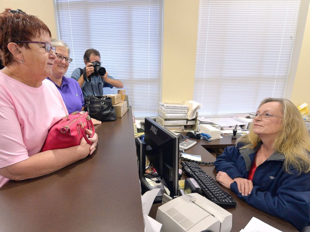 PHOTO:Karen Roberts, left, and her partner, April Miller, speak to Assistant Rowan County Clerk Kim Russell as they attempt to get a marriage license, Sept. 1, 2015, at the Rowan County Courthouse in Morehead, Ky.
