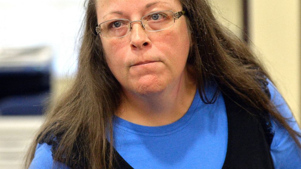 Rowan County Clerk Kim Davis listens to a customer following her office's refusal to issue marriage licenses, Sept. 1, 2015,at the Rowan County Courthouse in Morehead, Ky.