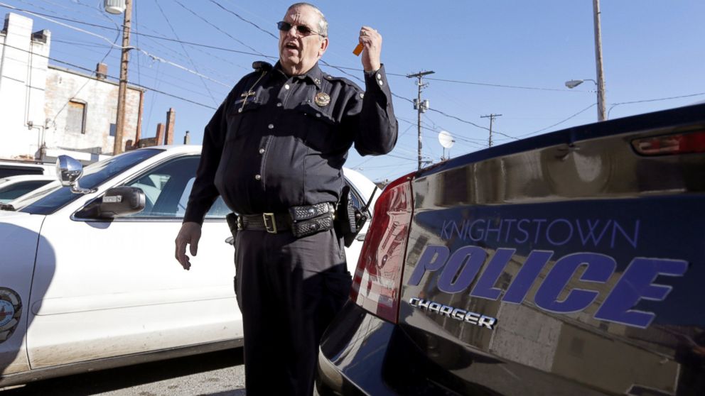 Knightstown Police Chief Danny Baker talks about the condition of the department's patrol cars outside the station in Knightstown, Ind. Baker is trying to raise money to lease a new car for the department by agreeing to be shot with his Taser. 
