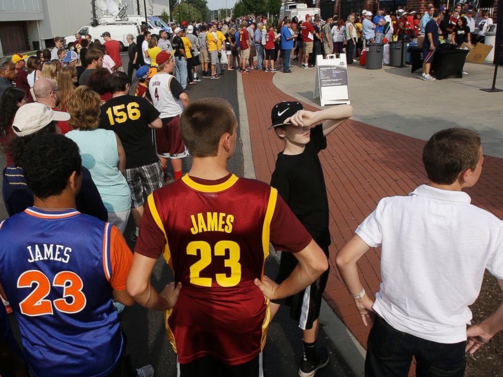 PHOTO: Fans wait in line to enter InfoCision Stadium for the LeBron James homecoming event