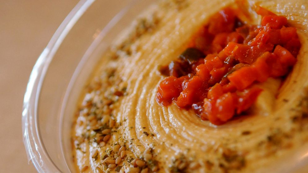 PHOTO: In this July 12, 2012 file photo, a sample of Sabra hummus is set out during a groundbreaking ceremony for the expansion of Sabra Dipping Co.'s Chesterfield County, Va. production facility. Sabra Dipping Co.