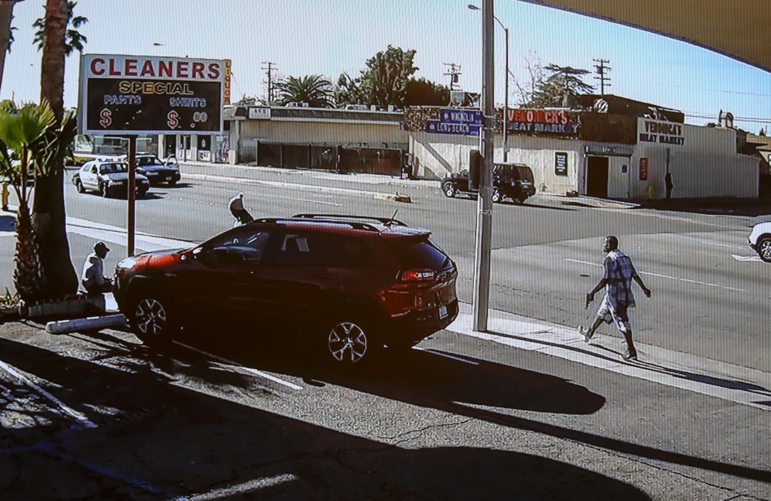 PHOTO: In this image made from security video footage provided by the Los Angeles County Sheriff, a man, right, walks with a gun in his hand, Dec. 12, 2015 in Lynwood, Calif.