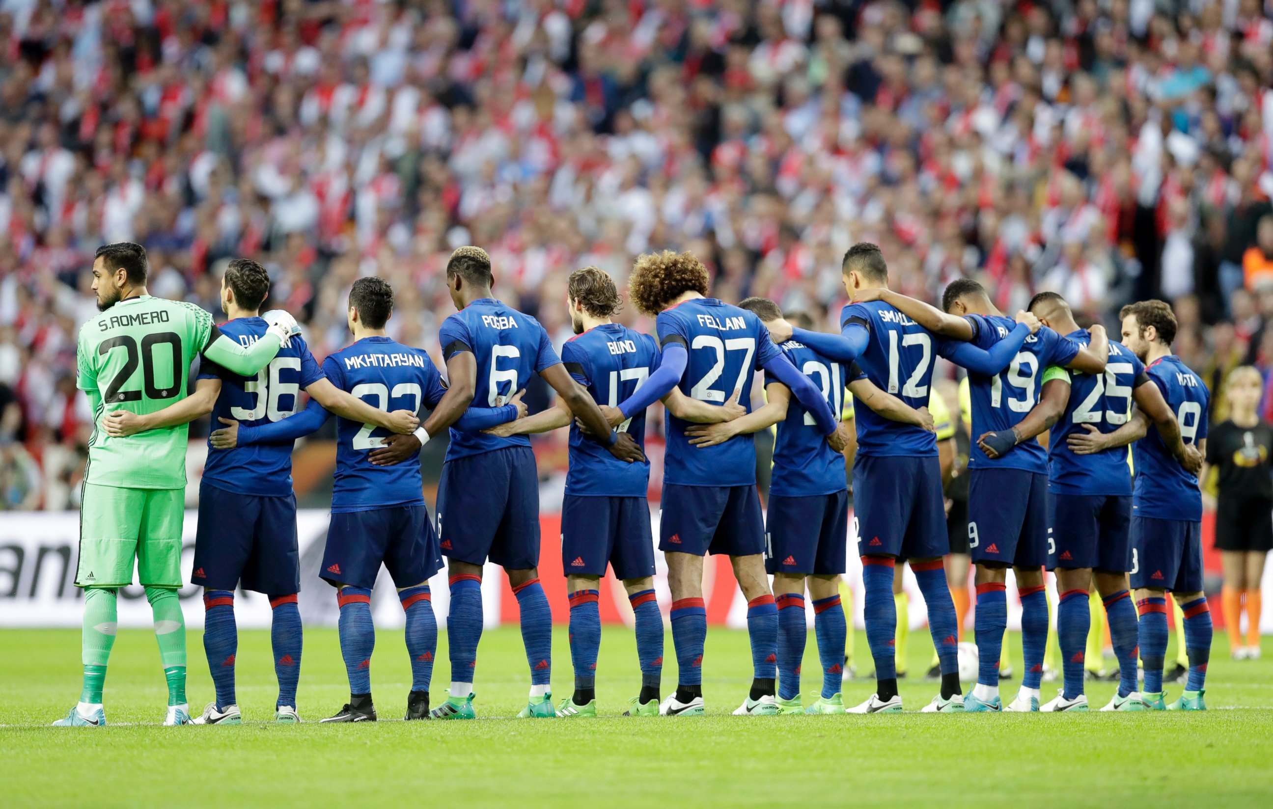 PHOTO: Manchester's team observe a minute of silence to commemorate the victims of the Manchester attack prior to the start of the Europa League final between Ajax Amsterdam and Manchester United at the Friends Arena in Stockholm, Sweden, May 24, 2017.