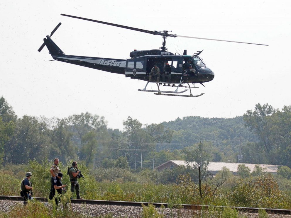 PHOTO:Police on foot and in the air search for suspects in the shooting of a police officer, Sept. 1, 2015, in Fox Lake, Ill.