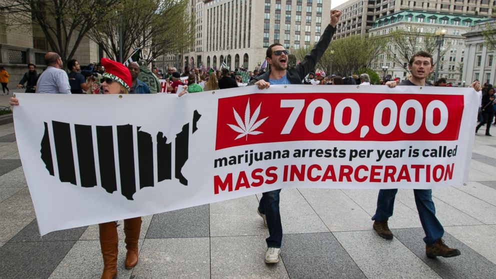Demonstrators march for the legalization of marijuana outside of the White House, in Washington, April 2, 2016.