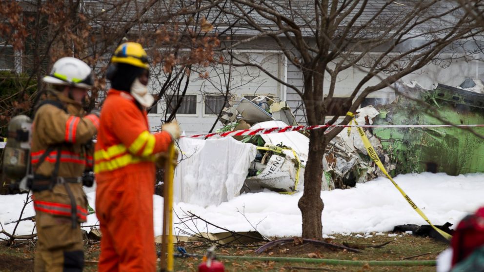 PHOTO: The wreckage of a small private jet sits in a driveway after crashing into a neighboring house in Gaithersburg, Md. on Dec. 8, 2014.