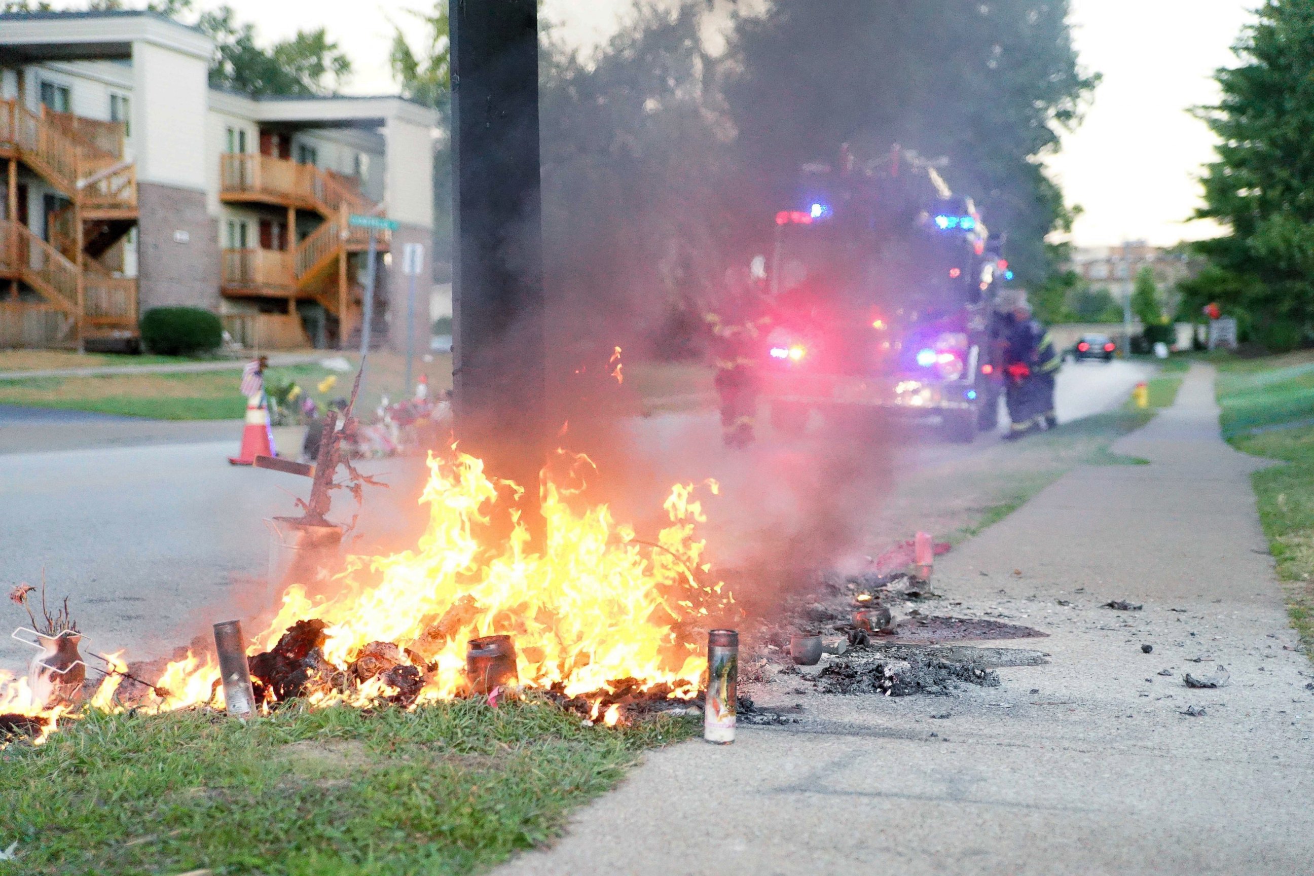 PHOTO: A fire burns, Sept. 23, 2014, at a memorial in Ferguson, Mo., on the site where a Missouri police officer fatally shot 18-year-old Michael Brown. 