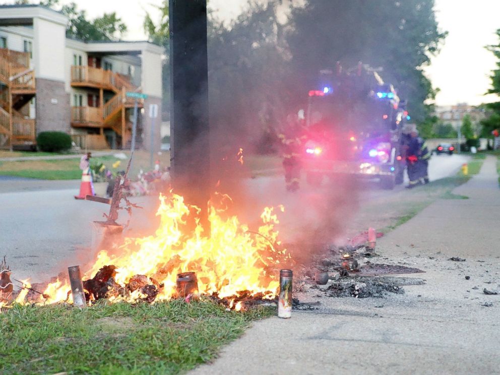 PHOTO: A fire burns, Sept. 23, 2014, at a memorial in Ferguson, Mo., on the site where a Missouri police officer fatally shot 18-year-old Michael Brown.
