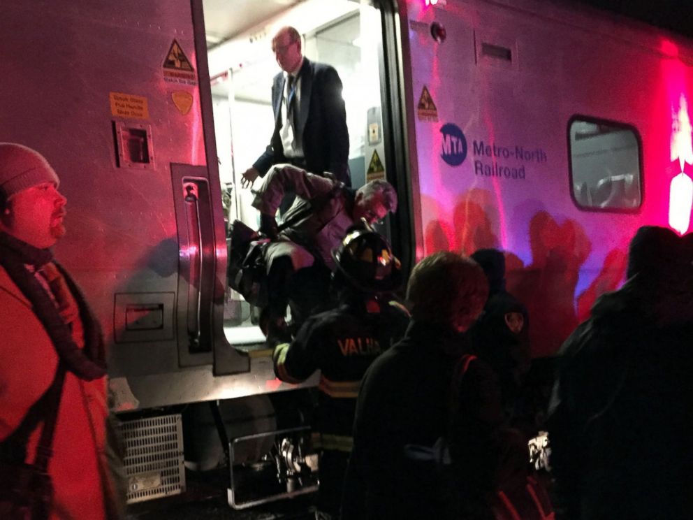 PHOTO: Passengers are assisted off a Metro-North Railroad passenger train in Valhalla, N.Y., Feb. 3, 2015.