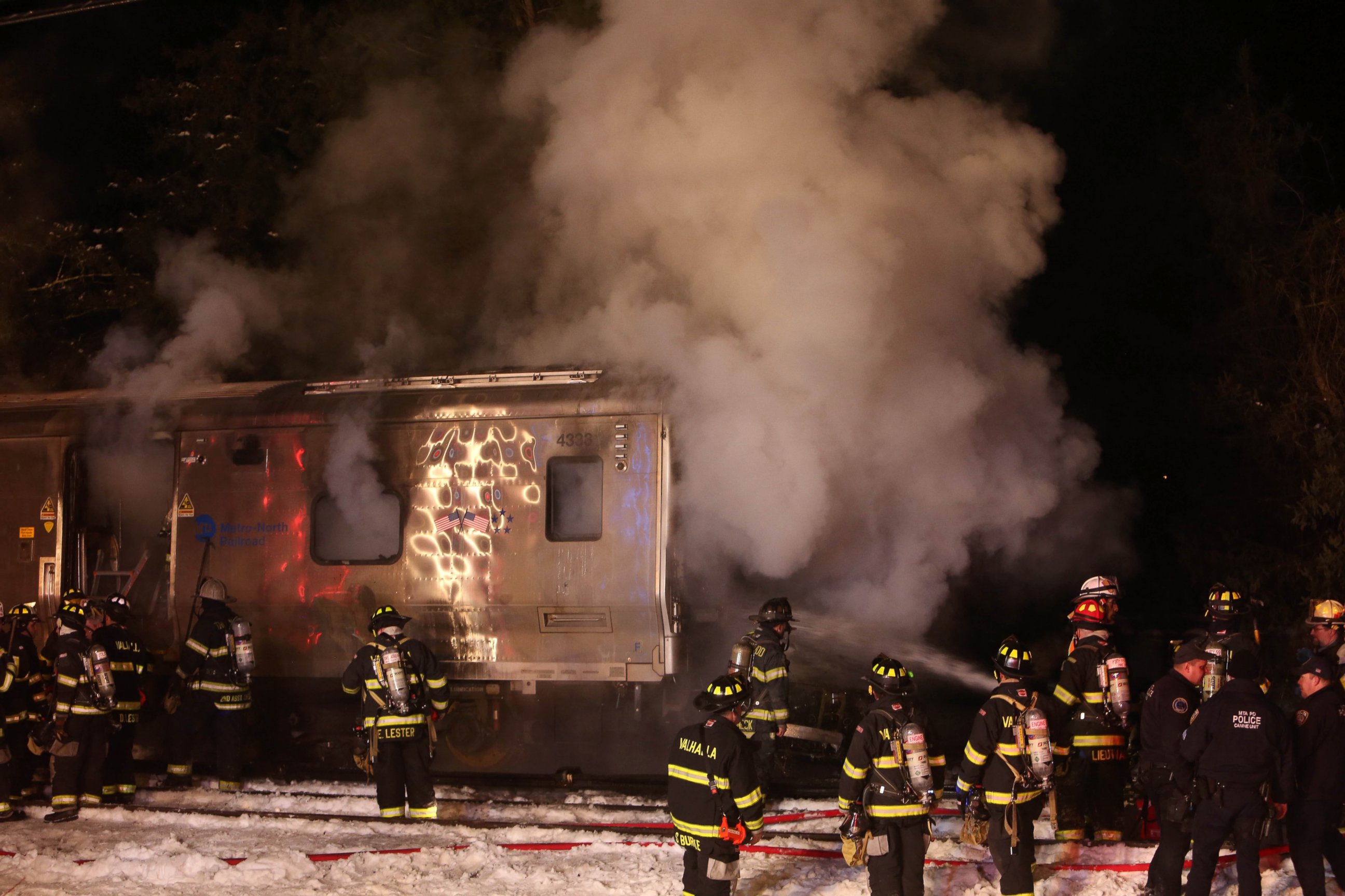 PHOTO: Firefighters work the scene of a collision between a Metro-North Railroad passenger train and a vehicle in Valhalla, N.Y., Feb. 3, 2015. 