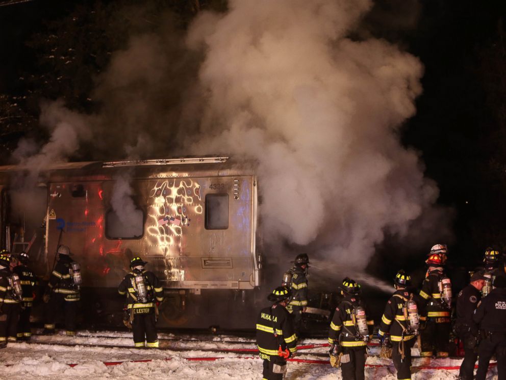 PHOTO: Firefighters work the scene of a collision between a Metro-North Railroad passenger train and a vehicle in Valhalla, N.Y., Feb. 3, 2015.