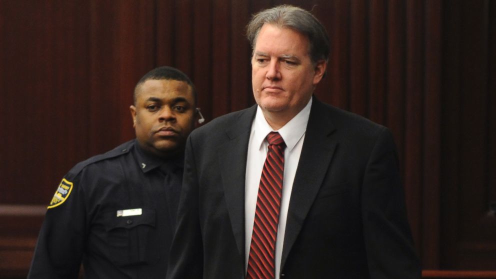 Defendant Michael Dunn is brought into the courtroom just before 5 p.m., where Judge Russell Healey announced that the jury was deadlocked on charge one and have verdicts on the other four charges as they deliberate in the trial of Dunn, Saturday Feb. 15, 2014.