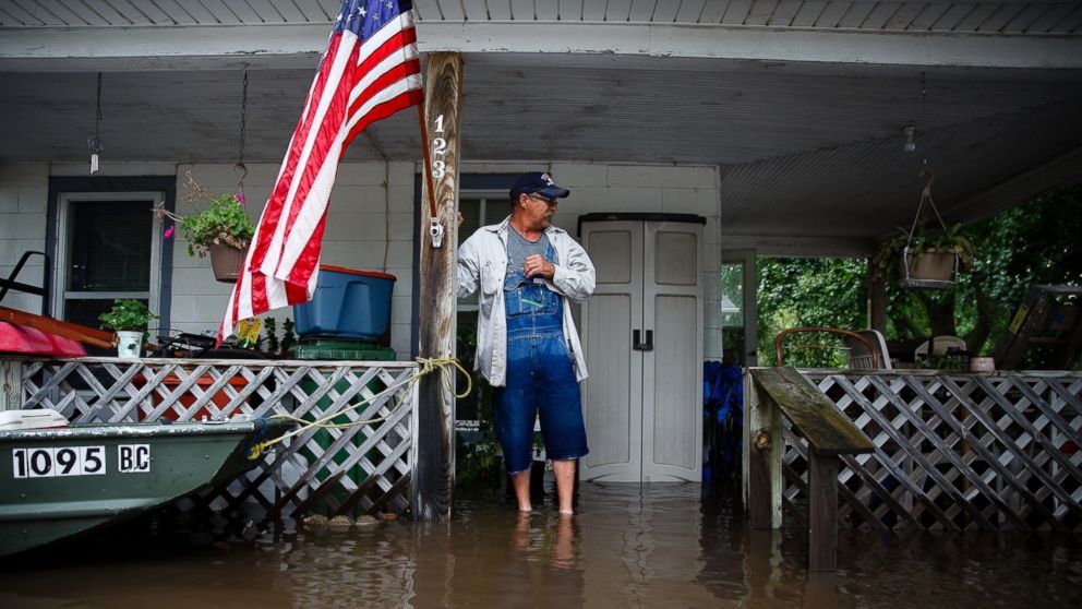 PHOTO: Tom Moffitt stands on his deck as he looks at the flood waters, Sept. 23, 2016, in Shell Rock, Iowa.