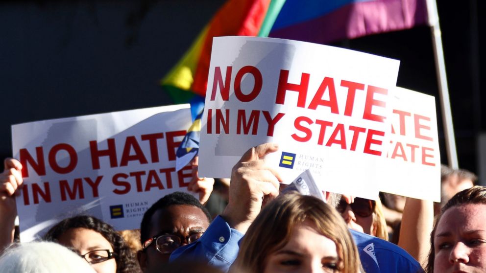 Protesters call for Mississippi Gov. Phil Bryant to veto House Bill 1523, which they says will allow discrimination against LGBT people, during a rally outside the Governor's Mansion in Jackson, Miss., April 4, 2016.