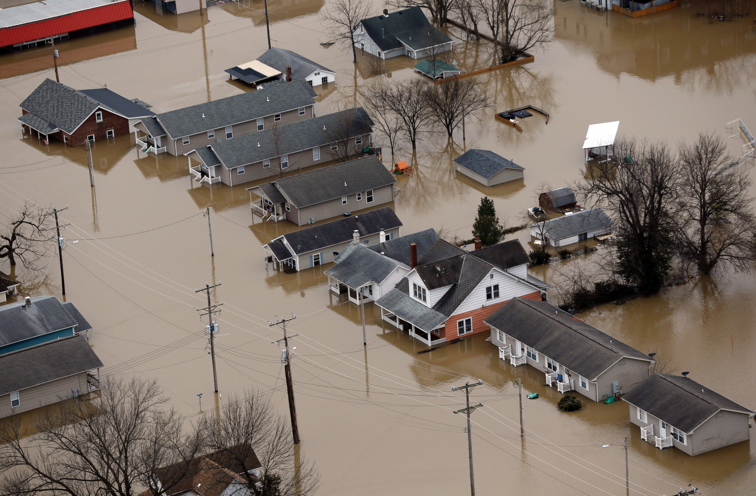 PHOTO: In this aerial photo, homes are surrounded by floodwater, Dec. 30, 2015, in Pacific, Mo.