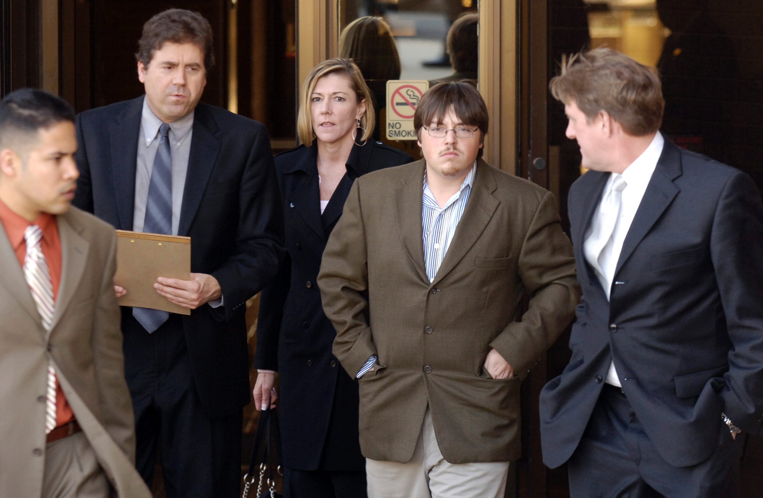 PHOTO: Defense attorney John B. Schisler, second from left, and his client Mitchell Johnson, 23, second from right, walk out of the Federal Building during a lunch break from Johnson's trial, Jan. 29, 2008, in Fayetteville, Ark. 