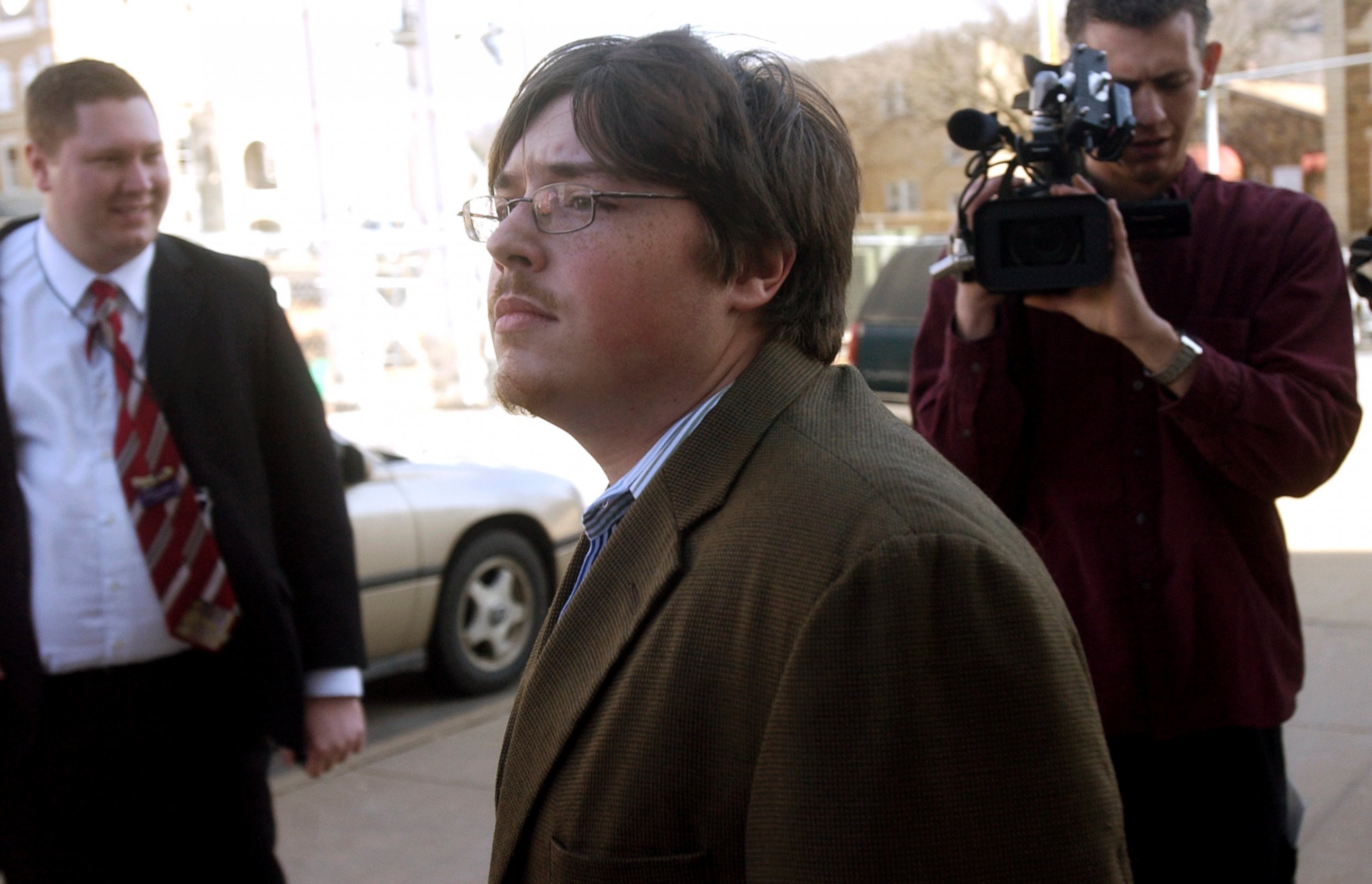 PHOTO: Jonesboro school shooter Mitchell Johnson, center, walks past members of the media during a lunch break from his trial at the Federal Building, Jan. 29, 2008 in Fayetteville, Ark. 