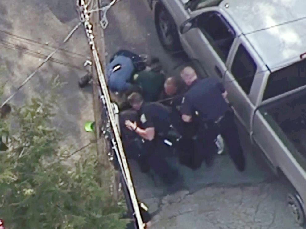 PHOTO: This aerial image made from a helicopter video provided by WHDH shows several officers arresting Richard Simone after a high-speed police pursuit in Nashua, N.H., May 11, 2016.