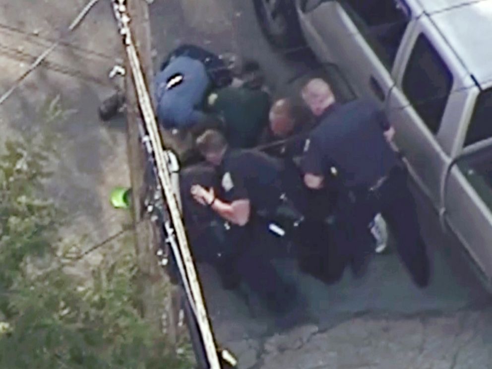 PHOTO: This aerial image made from a helicopter video provided by WHDH shows several officers arresting Richard Simone after a high-speed police pursuit in Nashua, N.H., May 11, 2016.