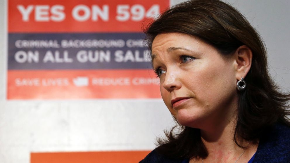 Nicole Hockley is interviewed before working at a phone bank in support of Washington's Initiative 594, a measure seeking universal background checks on gun sales and transfers, Oct. 27, 2014, in Seattle.