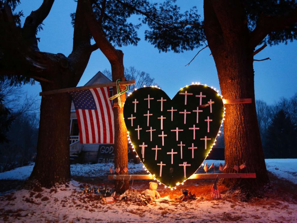 PHOTO: A memorial with crosses for the victims of the Sandy Hook Elementary School shooting massacre stands outside a home in Newtown, Conn., on the one-year anniversary of the shootings, Dec. 14, 2013.