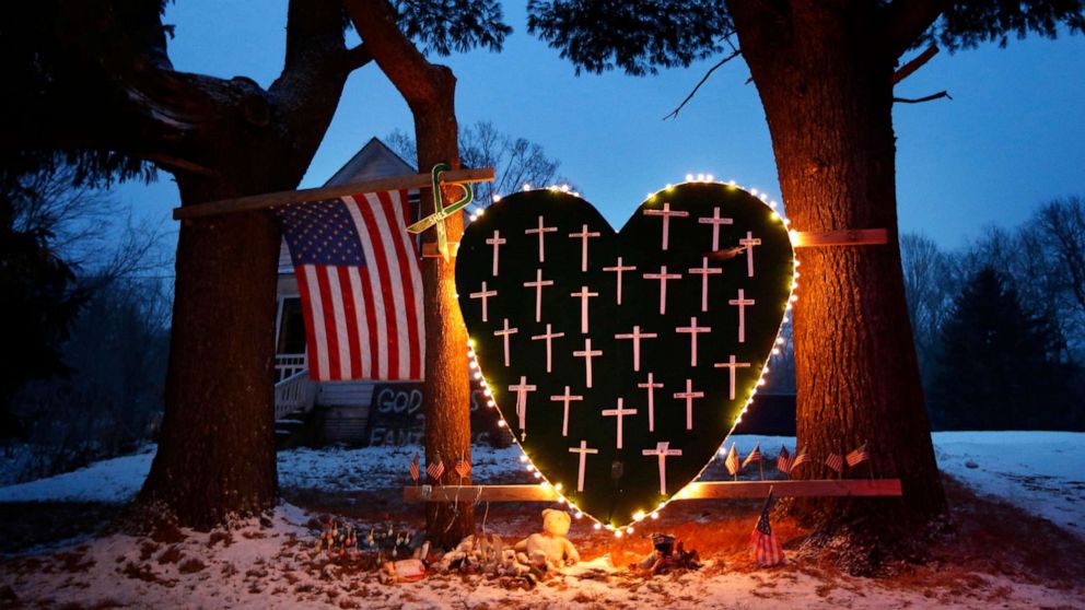 PHOTO: In this Dec. 14, 2013 file photo, a makeshift memorial with crosses for the victims of the Sandy Hook massacre stands outside a home in Newtown, Conn.