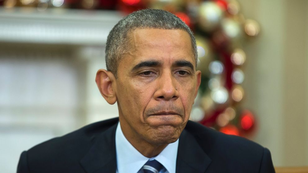 President Barack Obama pauses while making a statement on Wednesday's mass shooting in San Bernardino Calif., Dec. 3, 2015, in the Oval Office of the White House in Washington.